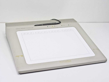 HP Hewlett-Packard 9111A Graphics Tablet — front view showing 12x9 inch drawing surface, tethered stylus resting on top, and yellowed beige housing with light soiling