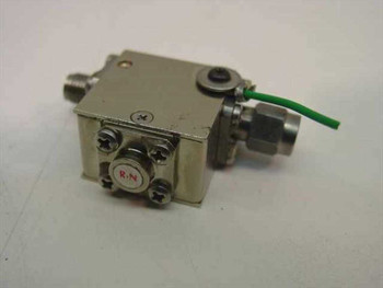Channel Microwave ALS343-4 Coaxial Isolator – rear/side view showing SMA connectors, ferrite assembly, and green grounding wire