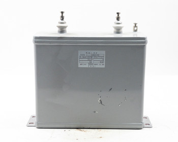 TOEI O82130 high voltage capacitor – front view showing gray steel tank body and white label with specifications