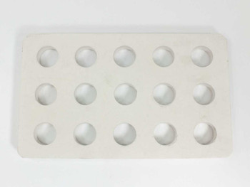 Cotronics ceramic plate — top-down view showing 3x5 grid of 15 machined circular holes across the white ceramic surface