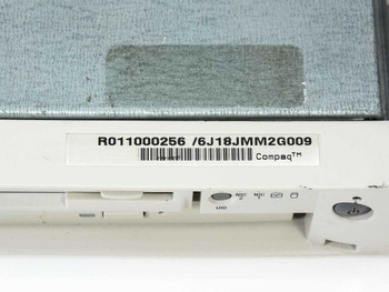 Compaq ProLiant DL320 label close-up showing part number R0011000256 and serial barcode 6J18JMM2G009