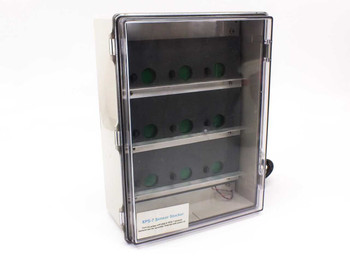 Cosmos XPS-7 Sensor Stocker front view with clear hinged door closed showing 9 green sensor slots across three shelves