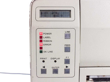 SATO M-8400 close-up of front control panel showing LCD display with garbled text, POWER/LABEL/RIBBON/ERROR/ON LINE LED indicators, and LINE, FEED, F1, PRINT, DISPLAY, ENTER buttons