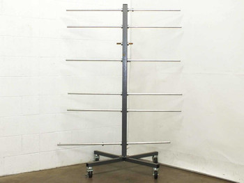 Industrial metal roll storage cart on swivel casters with 6 horizontal aluminum rod arms on a cross-base frame — full front view