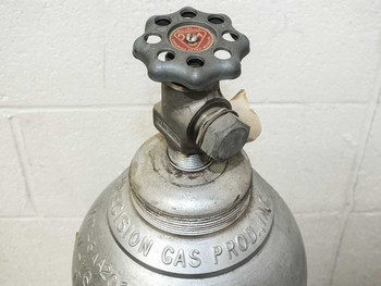 Top of Precision Gas Products specialty gas cylinder showing Superior Valve Company handwheel valve and neck threads
