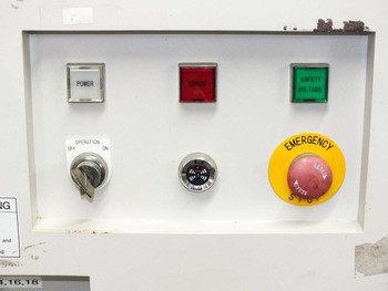 USHIO B0048 UV Flash Power Supply – front control panel detail showing POWER, ERROR, and SAFETY VOLTAGE indicator buttons, OPERATION OFF/ON toggle switch, rotary selector, and EMERGENCY STOP mushroom button