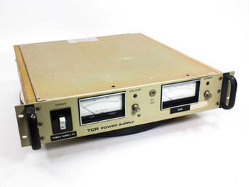 Electronic Measurements TCR 150S7-1-0386T DC power supply — front three-quarter view showing analog voltage and current meters and power switch