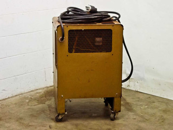 Hobart 1R6-504 battery charger rear view showing yellow cabinet exterior, ventilation mesh panel, and AC power cable coiled on top