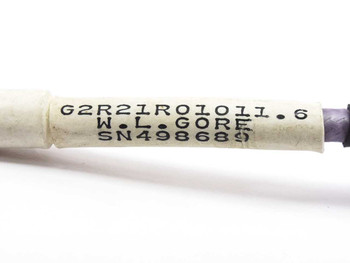 W.L. Gore G2R21R01011.6 cable label detail showing part number, manufacturer name, and serial number on white ferrule
