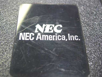 NEC America Inc logo closeup on top of the 9712-305-491B power supply unit showing surface scratching on label