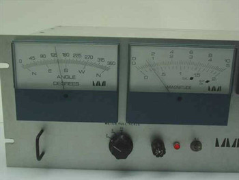 Marsh-McBirney Model 500 front panel close-up — left meter shows Angle in Degrees (0–360, N/E/S/W), right meter shows Magnitude scale, red indicator light and rotary selector visible
