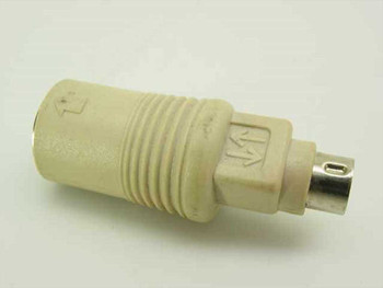 PS/2 Male to AT DIN-5 Female keyboard adapter – side profile view showing beige body and PS/2 mini-DIN male connector end