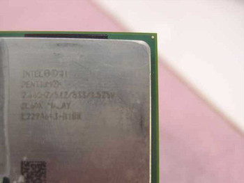Intel Pentium 4 SL6DV close-up of IHS label showing 2.4GHz 512/533/1.525V specs and SL6DV stepping