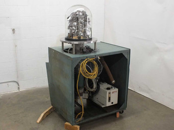 NRC 3114 Sputtering Chamber side view with cabinet open showing Varian SD-700 rotary vacuum pump, yellow power cable, and internal plumbing