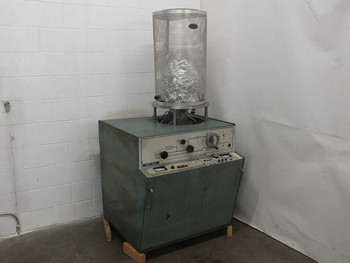 NRC 3114 Sputtering Chamber front view showing cracked glass bell jar mounted on base cabinet with front control panel