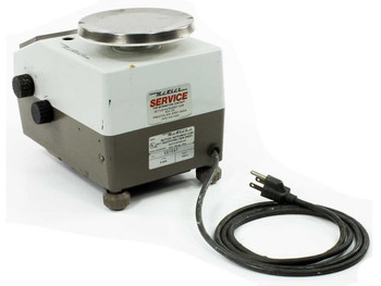 Mettler E2000 benchtop balance – left side view with power cord extended and Mettler Service label visible