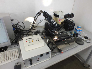Finetech Fineplacer system overview from left angle showing two-axis stage, Leica MZ6 microscope head, Sigma Koki SHOT-102 stage controller, and PC workstation