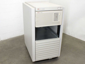 HP 9000 E35 server in HP C2785A rack enclosure — three-quarter front view showing upper HP Systems bezel and lower server bay with open card cage area