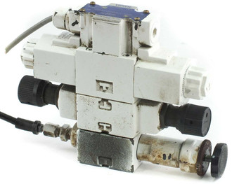 Yuken DSG-01-3C40-D24-50398 directional valve stack – rear/side view showing surface wear and hydraulic port faces