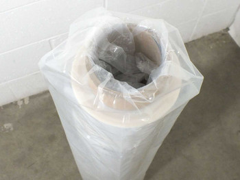 Top view of Airtech ETFE film roll showing cardboard core and plastic protective wrap
