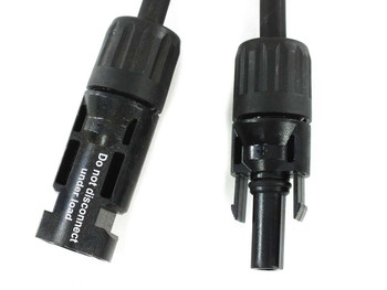 Close-up of Staubli MC4 male and female connectors — female shows 'Do not disconnect under load' safety label