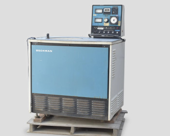 Beckman L5B-CT Ultracentrifuge front-left view showing blue cabinet and top-mounted control panel on wood pallet