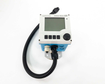 Endress+Hauser CM42 Liquiline M two-wire transmitter front view showing LCD display, navigation buttons, rotary selector, and Memosens sensor port with conduit