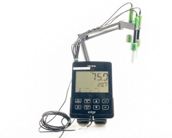 Hanna HI2040-01 edge meter full system view with three probes on articulating arm and AC adapter cable visible, LCD showing 75.0 and 20.7