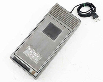 Solidex 828 VHS Video Cassette Rewinder – top-front angle view showing Solidex label and tape slot with AC cord