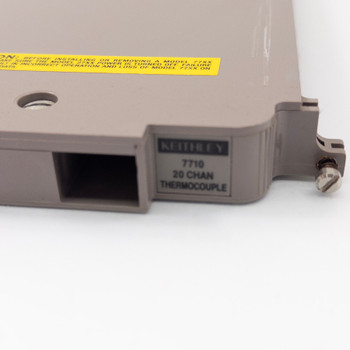 Keithley 7710 20-channel thermocouple scanner card — model label reading 7710 20 CHAN THERMOCOUPLE with yellow caution sticker visible