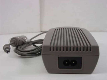 Compaq 261867-001 AC Adapter – rear view showing IEC C8 two-prong AC input and DC barrel output cable
