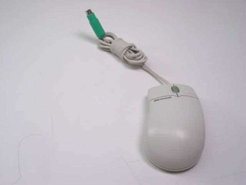 Microsoft IntelliMouse X03-65047 PS/2 trackball mouse – left side view showing light gray body and green PS/2 connector