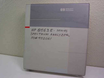 HP 8560 E-Series Spectrum Analyzer User's Guide binder — front cover with Hewlett-Packard logo and handwritten label reading HP 8563E Spectrum Analyzer
