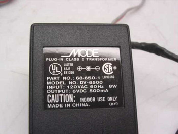 Mode Electronics DV-6500 label showing Part No. 68-650-1, 120VAC 60Hz 8W input, 6VDC 500mA output, UL and CSA certifications