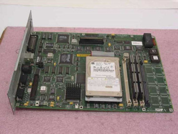 QMS 2293268-902J controller PCB top view showing onboard 2.5-inch hard drive, multiple ICs including Lattice chip, and memory modules