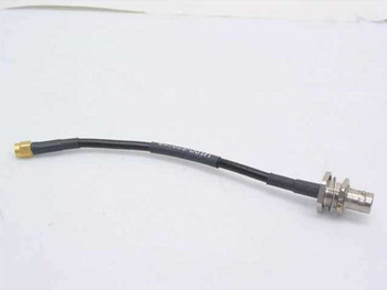RG-58 coaxial cable with SMA male connector on left and BNC female bulkhead connector on right, full cable view showing approximately 6-inch length