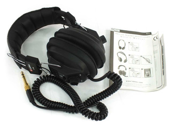 Labtec C-184 over-ear headphones with coiled cord, gold-plated 1/4" adapter, and user manual – three-quarter front view on white background