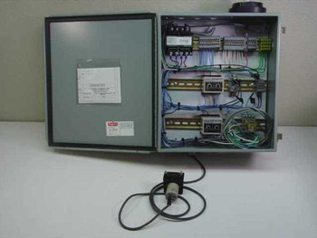 Omron S3S-B10-US Bulk Fill Control Panel MRLOB02 — enclosure open showing internal wiring, controllers, transformer, and terminal blocks with E2K-C25ME1 proximity switch on cable outside