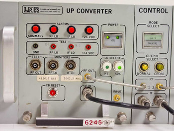 LNR UC6-D1 left upconverter front panel close-up showing alarm indicators, BNC test and monitor ports, LO select, power switch, and 4826.7 MHz / 1042.5 MHz LO frequency labels