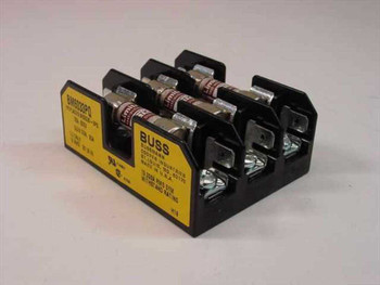 Bussmann BM6033PQ 3-pole fuse holder with Limitron KTK-5 fuses installed — front three-quarter view showing yellow label and black housing