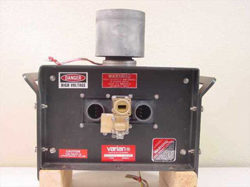 Varian VKU-7791Z8 klystron – rear view showing waveguide output port, circular RF output flange, and high-voltage warning labels
