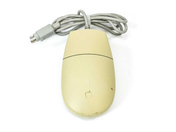 Apple Desktop Bus Mouse II M2706 – top view showing platinum gray body and Apple logo, light surface soiling visible