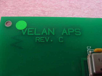 Close-up of Velan APS Rev C silkscreen label on green PCB board