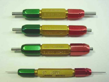 Close-up of four double-ended go/no-go thread plug gauges showing green Go ends, gold anodized bodies with mm size markings, and red No-Go ends