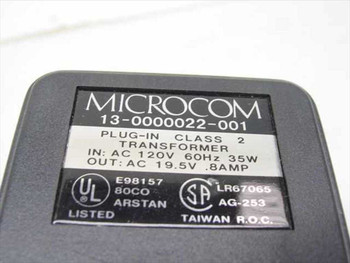 Microcom 13-0000022-001 label closeup showing Class 2 transformer specs: IN AC 120V 60Hz 35W, OUT AC 19.5V 0.8A, UL Listed, Taiwan R.O.C.