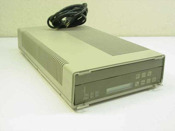 Motorola Codex 2264 External Desktop Data Modem – front-left three-quarter view showing vented top housing and front panel with LED display and control buttons, power cable coiled on top