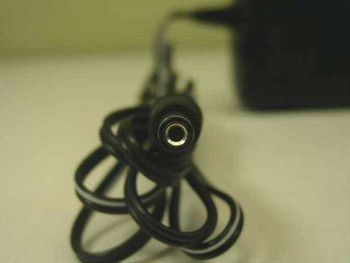 CUI Inc DPD120100-P5-SZ barrel plug connector close-up showing negative-center output tip