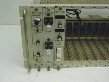 Dunegan-Endevco card cage close-up of front panel showing Model 701 audio monitor, 302A dual amplifier, and 303 dual counter module controls and indicators