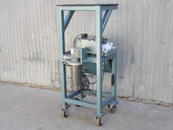 Pinnacle ECO Slitter Reroller assembly showing Emerson DC motor cylinder and rear mechanical components on mobile frame