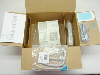 NEC Dterm Series II 560110 telephone new old-stock in opened Qwest box with handset, line cord, coiled cord, and documentation visible